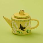 tea pot yellow with bird